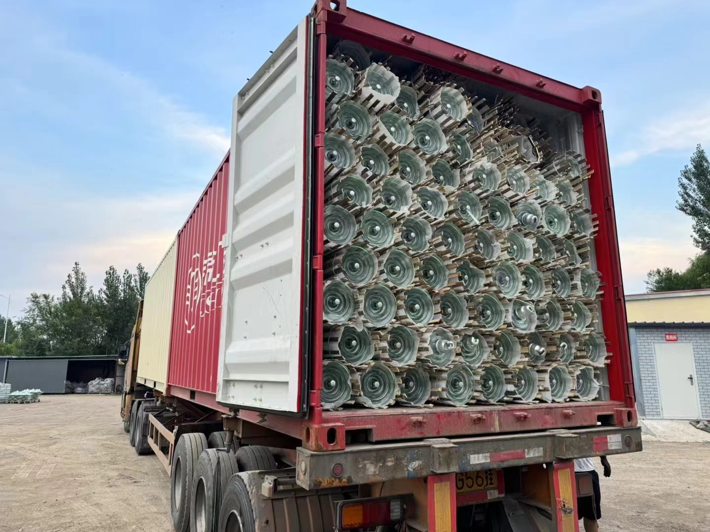 Glass insulators are loaded into cabinets and shipped out